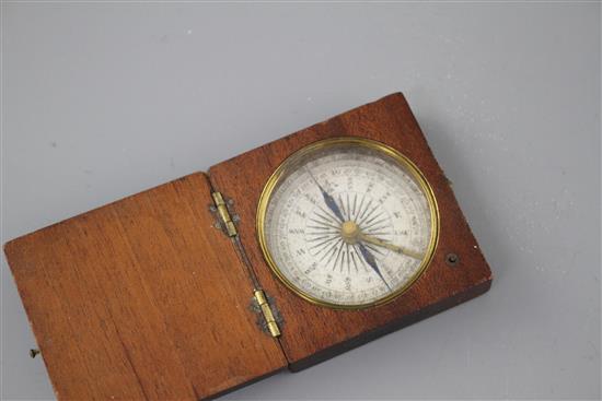 An early 19th century mahogany cased pocket compass, the dial marked in quadrants of ten degree divisions, the case 5cms sq.